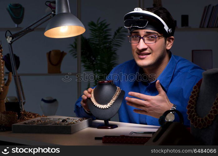 Jeweler working in his workshop late at night