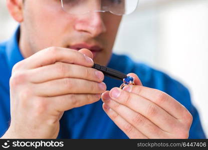 Jeweler working with luxury jewelry in the workshop