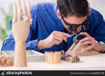 Jeweler working with luxury jewelry in the workshop