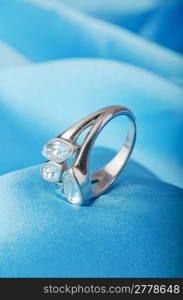 Jewellery ring on the satin background