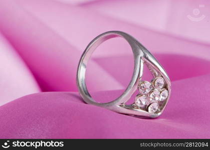 Jewellery ring on the satin background