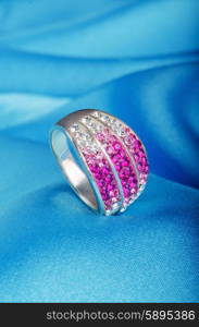 Jewellery ring on the satin background