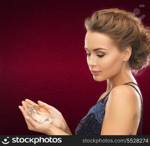 jewelry and beauty concept - beautiful woman in evening dress with big diamond