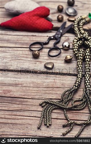 Jewelry and chain. metal chain and beads for craft on wooden background