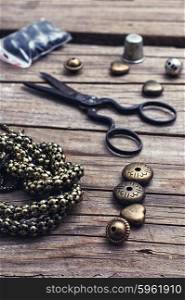 Jewelry and chain. metal chain and beads for craft on wooden background