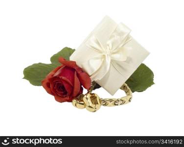 Jewelry gold with red rose on white background