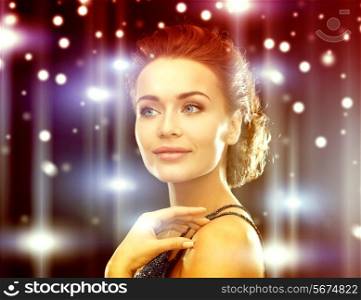 jewelry, luxury, vip, nightlife, party concept - beautiful woman in evening dress