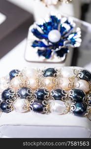 jewelry retail showcase display different pearl bracelets