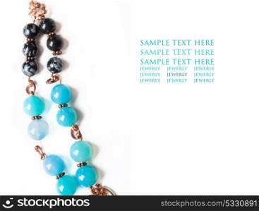 jewerly bracelet with chalcedony and obsidian around white background