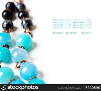 jewerly with chalcedony and obsidian around white background