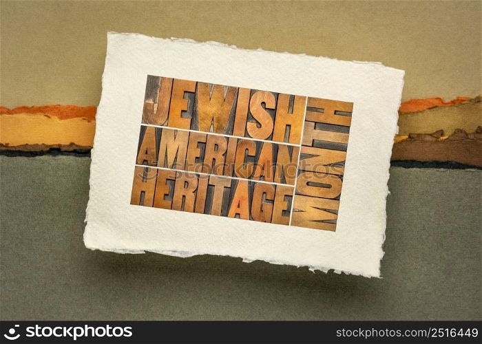 Jewish American Heritage Month - word abstract in vintage letterpress wood type on a handmade paper against abstract landscape, Jew legacy and tradition concept
