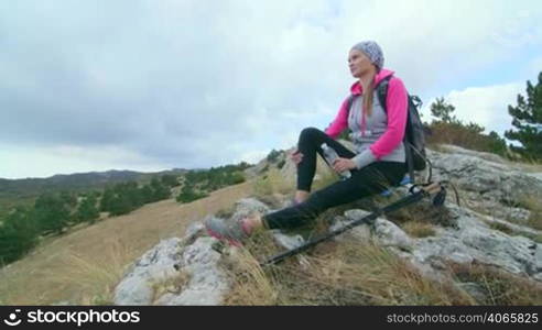 JIB CRANE: Day hiking in Crimean mountains woman hiker enjoying view of amazing Ai-Petri plateau