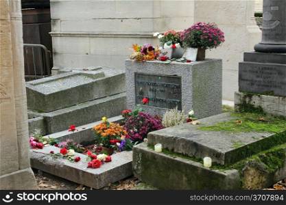 Jim Morrison grave in Pere Lachaise cemetery, Paris. Each year thousands fans and curious visitors come to pay homage to Jim Morrison&rsquo;s grave.