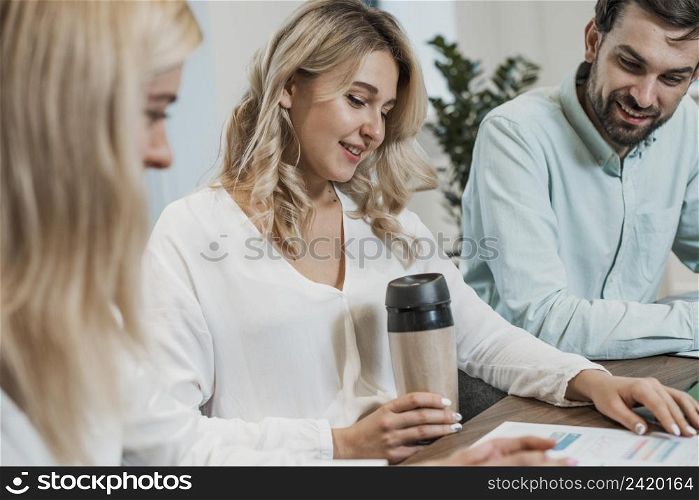 job colleagues working drinking coffee