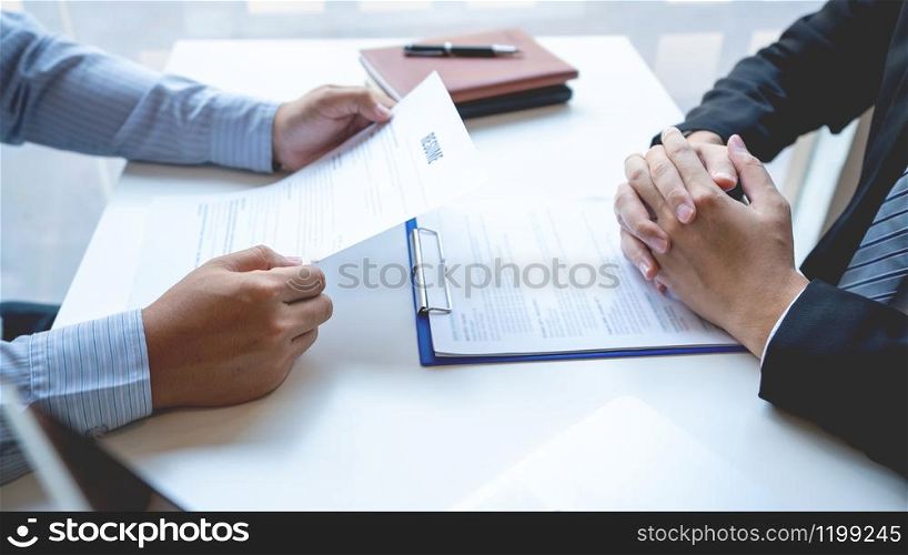 Job Interview and hiring concept, Appointment candidate Business man explaining about his profile and answer to Human resources manager sitting at a table opposite in the office