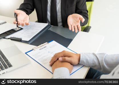 Job Interview and hiring concept, Appointment candidate Business man explaining about his profile and answer to Human resources manager sitting at a table opposite in the office