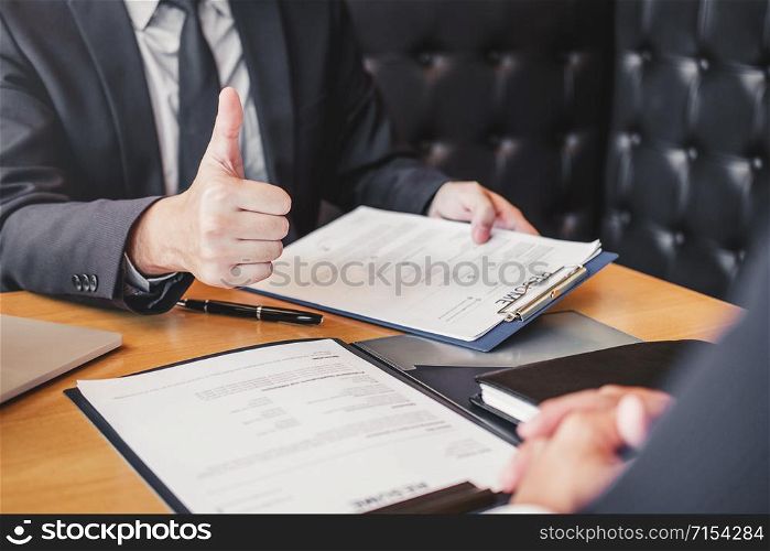 Job interview concept , Senior manager reading a resume during a job interview employee young man meeting Applicant and recruitment