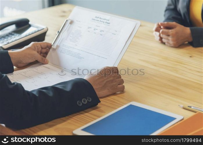 Job Interview HR human resource manager interviewing new employee candidate look at CV Resume asking job requirement question at business firm office desk. Job Interview headhunter agent application