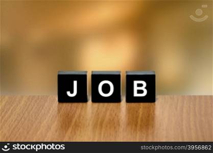job on black block with blurred background