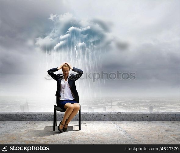 Job seeking. Image of young troubled businesswoman standing under rain