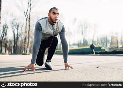 Jogger before running, active, healthy lifestyle. Athlete on morning fitness workout. Runner in sportswear on training outdoor