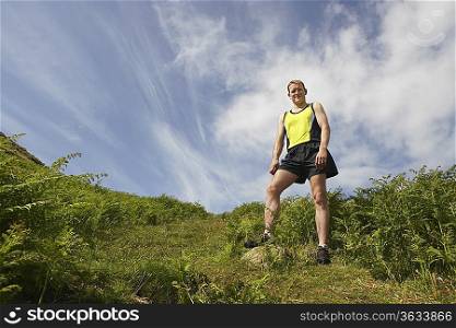 Jogger Standing in Meadow