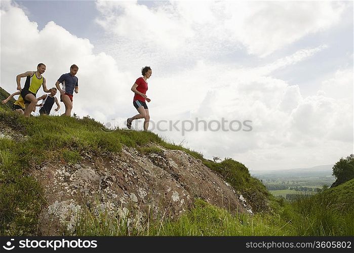 Joggers Running Downhill