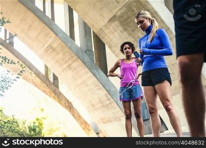 Joggers taking break on bridge, Arroyo Seco Park, Pasadena, California, USA