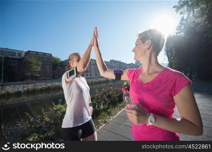jogging friends couple congratulate and happy to finish their morning workout