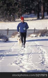 Jogging in the Snow with a Dog