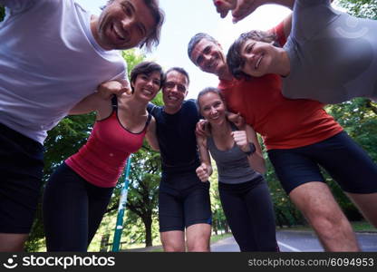 jogging people group, friends have fun, hug and stack hands together after training