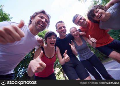 jogging people group, friends have fun, hug and stack hands together after training