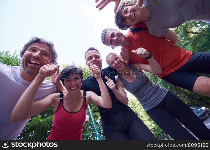 jogging people group, friends have fun, hug and stack hands together after training