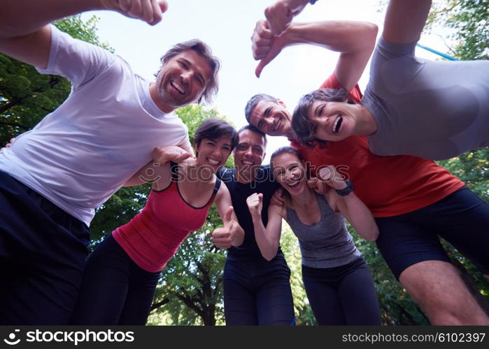 jogging people group, friends have fun, hug and stack hands together after training