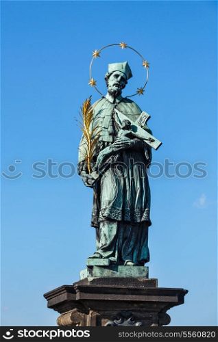 John of Nepomuk (or John Nepomucene) national saint of the Czech Republic statue on Charles Brigde at the site where the saint was thrown into Vltava, Prague