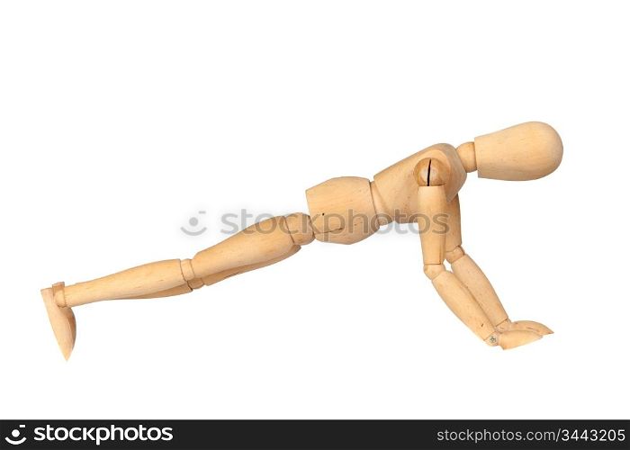 Jointed wooden mannequin doing push-ups isolated on white background