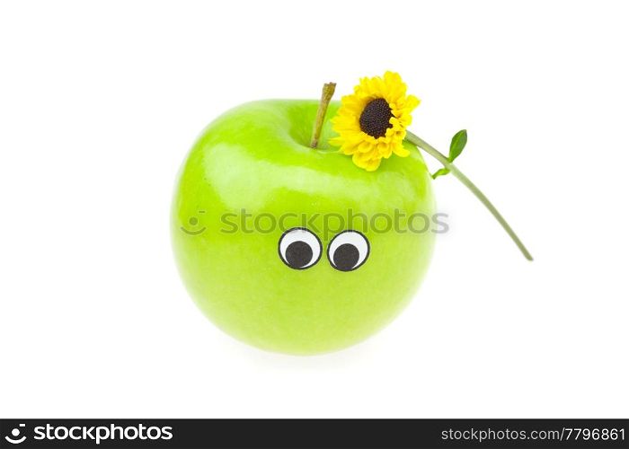 joke apple with eyes and a flower isolated on white