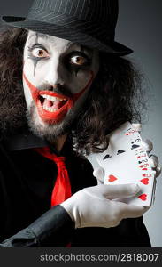 Joker with cards in studio shoot