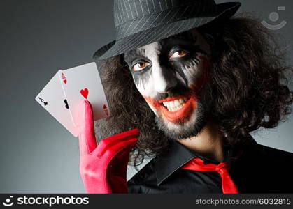 Joker with cards in studio shoot