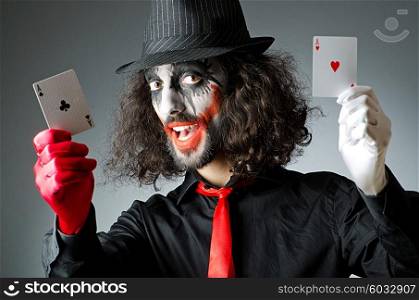 Joker with cards in studio shoot