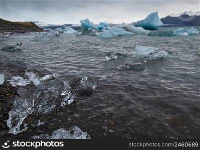 Jokulsarlon glacial lake, lagoon with ice blocks, Iceland. Situated near the edge of the Atlantic Ocean at the head of the Breidamerkurjokull glacier, Vatnajokull icecap or Vatna Glacier.