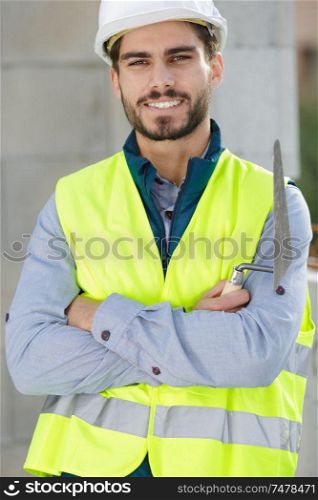 jolly smiling constructor wearing helmet