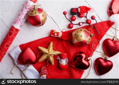 jolly traditional Christmas set with decorations and gifts. around white background. flat lay