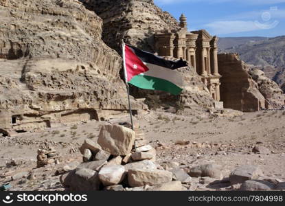 Jordan flag, rock and monastery in Petra, Jordan