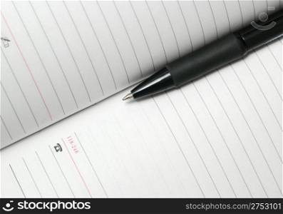 jotter and pen. The Notebook with a black ball pen