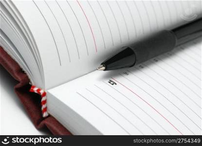 jotter and pen. The Notebook with a black ball pen