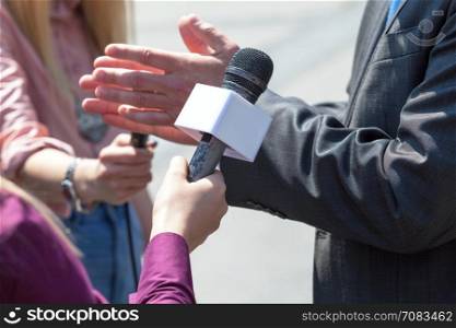 Journalist making interview with businessman or politician