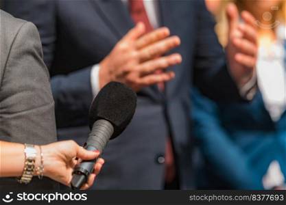 Journalists holding microphone, interviewing politician.. Journalist Conducting an Interview, Politician Answering Questions.