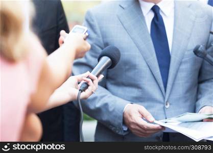 Journalists making media interview with business person or politician