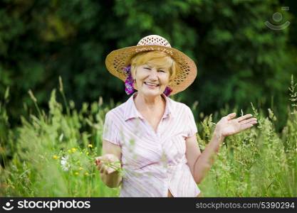 Joy. Friendly Happy Mature Woman in Straw Hut with Stretched Arms